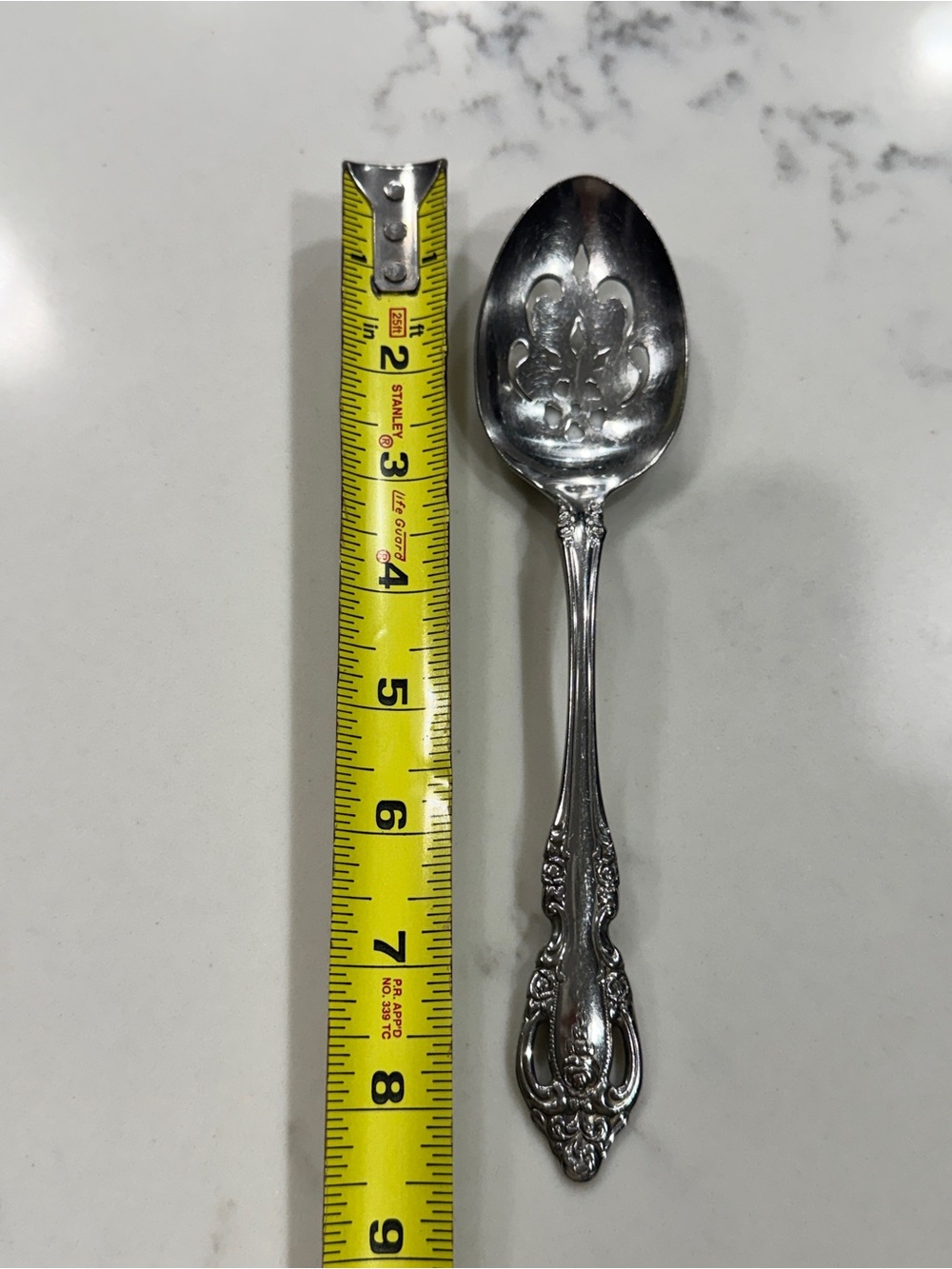 Oneida Community ornate Stainless steel slotted pierced serving spoon
